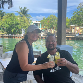 a man and woman holding drinks